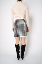 Load image into Gallery viewer, D. EXTERIOR KNITTED MINI SKIRT IN CLASSIC HOUNDSTOOTH PRINT
