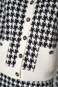 D. EXTERIOR BUTTON KNIT CARDIGAN IN CLASSIC HOUNDSTOOTH PRINT