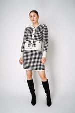 Load image into Gallery viewer, D. EXTERIOR KNITTED MINI SKIRT IN CLASSIC HOUNDSTOOTH PRINT
